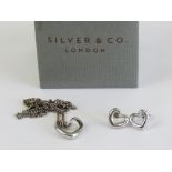 A delightful Mappin & Webb suite of HM silver jewellery comprising stud earrings and pendant on
