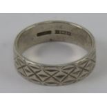 A HM silver ring having continuous engra