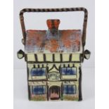 A hand painted ceramic wafer / biscuit barrel in the form of a beamed house 'Ye Olde Inne'.
