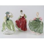 Three Royal Doulton figurine; HN2832 Fair Lady, HN2234 Michele, and HN2309 Buttercup.