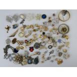 A quantity of assorted costume jewellery in a wicker work tray.