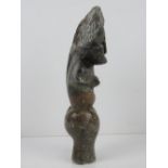 A soapstone fertility figurine standing