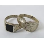 Two silver signet rings, one set with onyx, stamped 925, size S, the other having shield front,