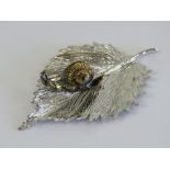 An unusual and superbly made HM silver ornament in the form of a gilded snail upon a leaf,