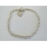 A substantial HM silver choker chain necklace having heart charm upon, T-bar clasp, hallmarked 925,
