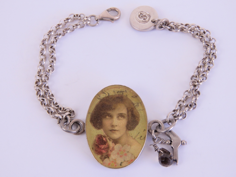 A HM silver double chain link bracelet having vintage style portrait to centre,