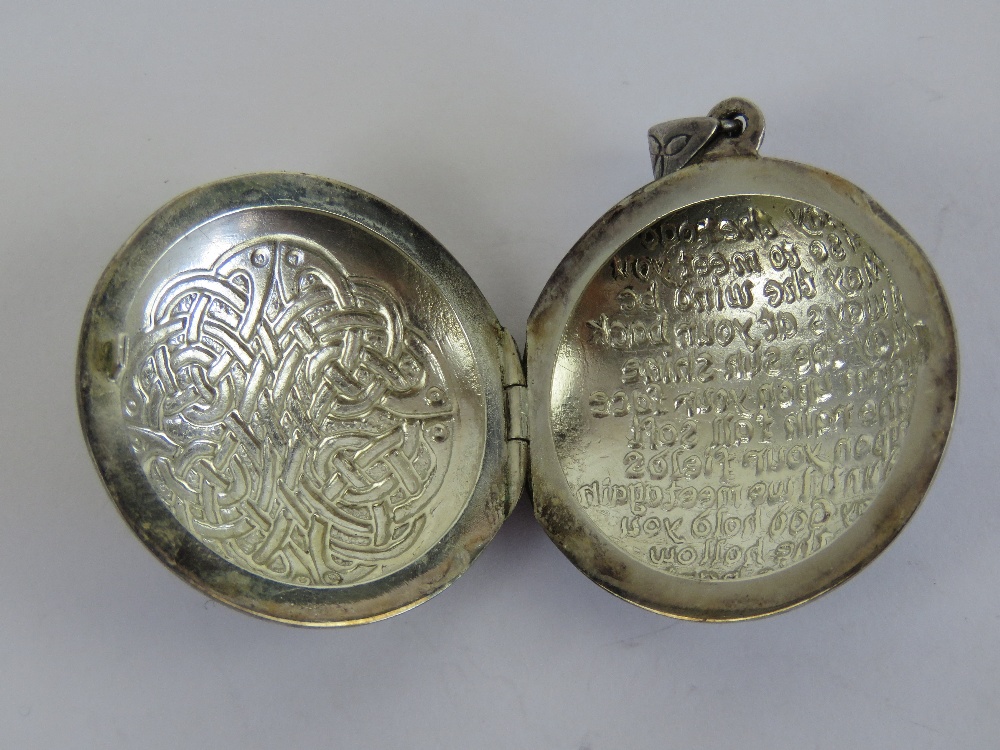 A large HM silver Celtic locket having Irish blessing and knot design upon 'May the road rise to - Image 3 of 4