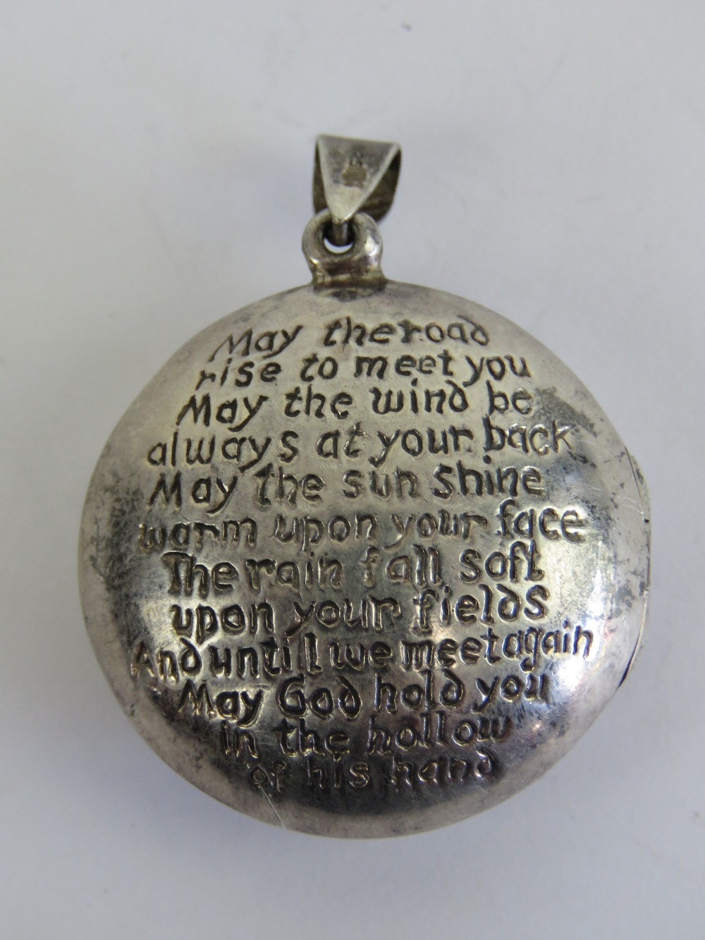 A large HM silver Celtic locket having Irish blessing and knot design upon 'May the road rise to - Image 2 of 4