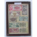 A framed montage of cWWII bank notes inc