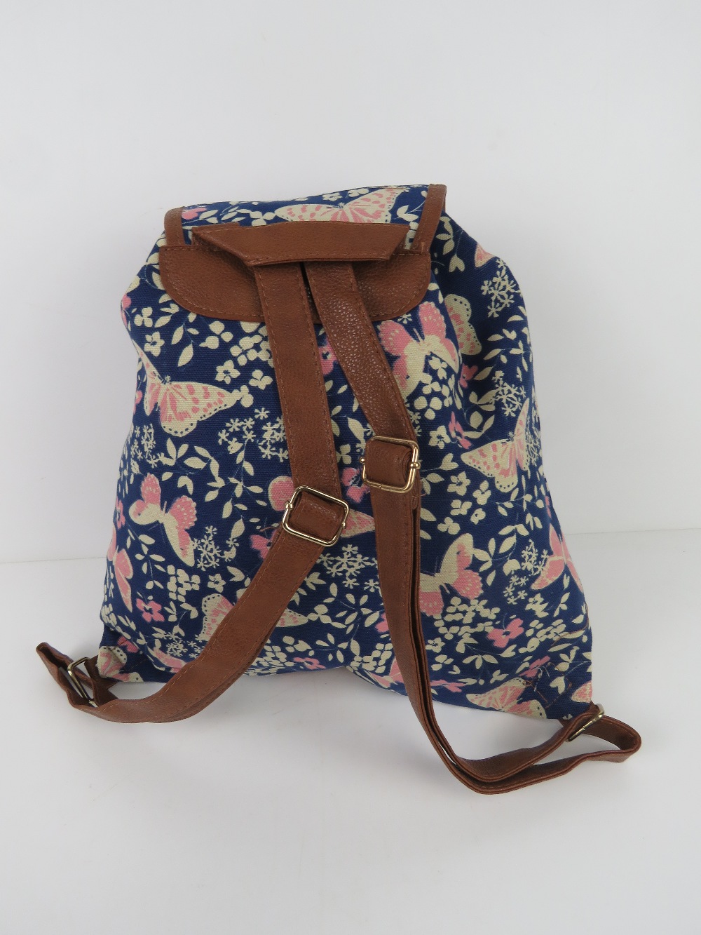 A navy and pink butterfly themed rucksac