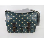 A green polka dot satchel type handbag '