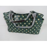 A green polka dot pattern handbag 'as ne