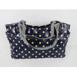 A blue polka dot pattern handbag 'as new
