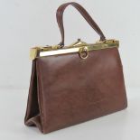 A vintage ladies brown leather handbag h