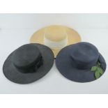 Three 100% straw hats in navy, black and