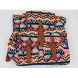 An Aztec pattern multi coloured ruck sac