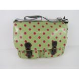 A green polka dot satchel type handbag '