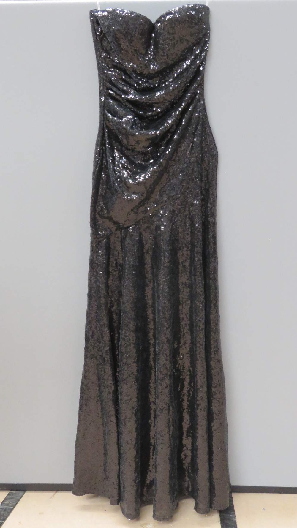 A floor length black sequin evening dres