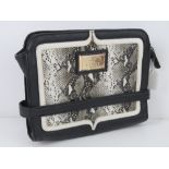 A clutch bag by Lipsy in black with 'pyt