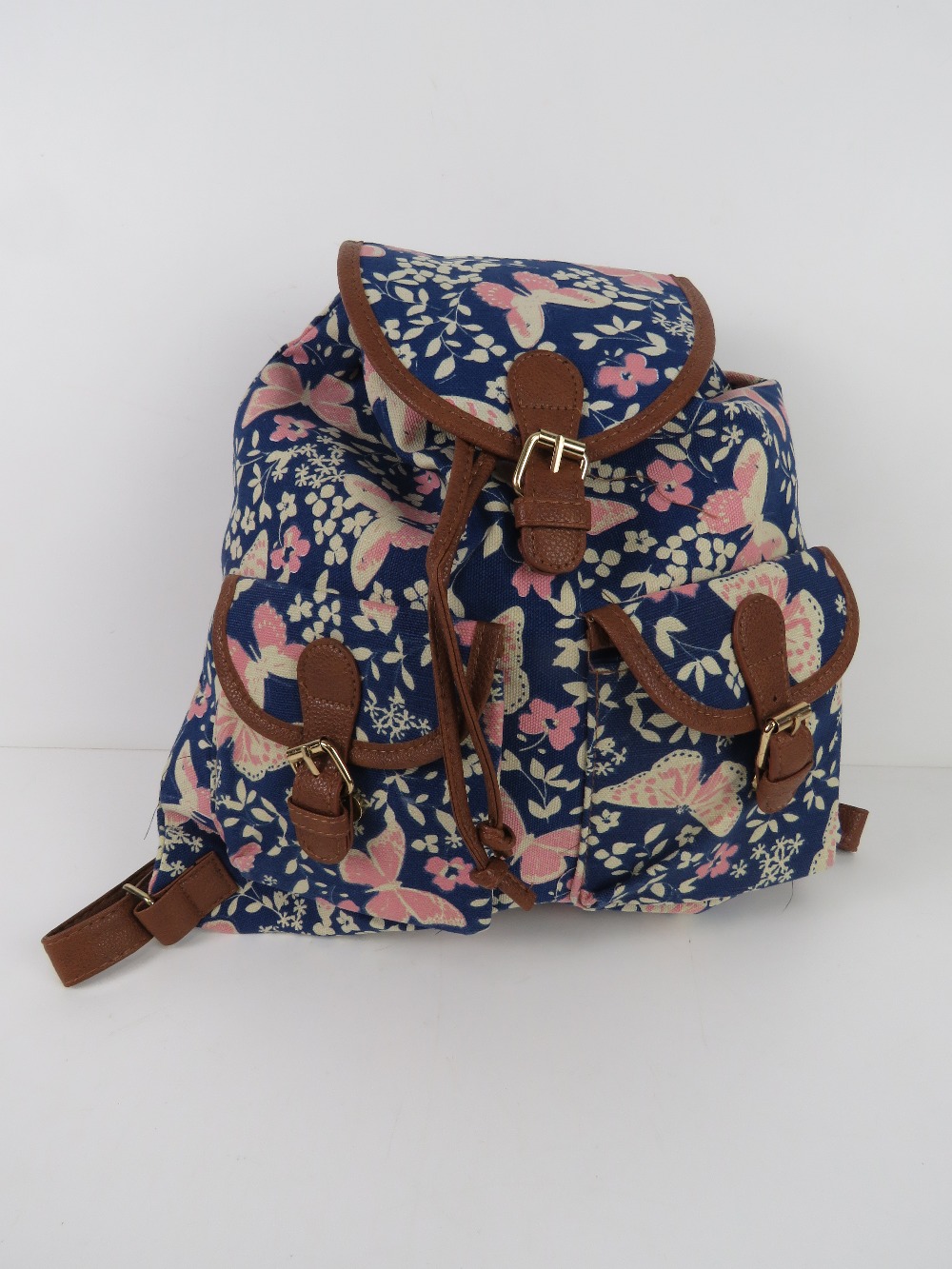 A navy and pink butterfly themed rucksac - Image 2 of 2