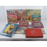 Four assorted and completed jigsaw puzzles with boxes (two a/f). Together with another jigsaw puzzle