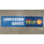 A vintage c1980s Shell Helix Motor Oils 'Lubrication Service' sign made on fibreboard and