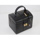 A contemporary black leather jewellery case having various compartments within. 14.5 x 11.5 x 19cm.