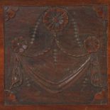 A carved mahogany panel having decorative swag designs in three sections, 67.8 x 24.3cm.