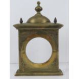 A heavy cast brass clock front of architectural form, 19cm wide, 28cm high, 1.75kg.