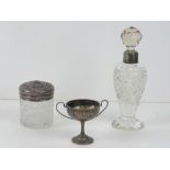 A HM silver trophy cup, together with a cut glass scent bottle having HM silver rim and a white