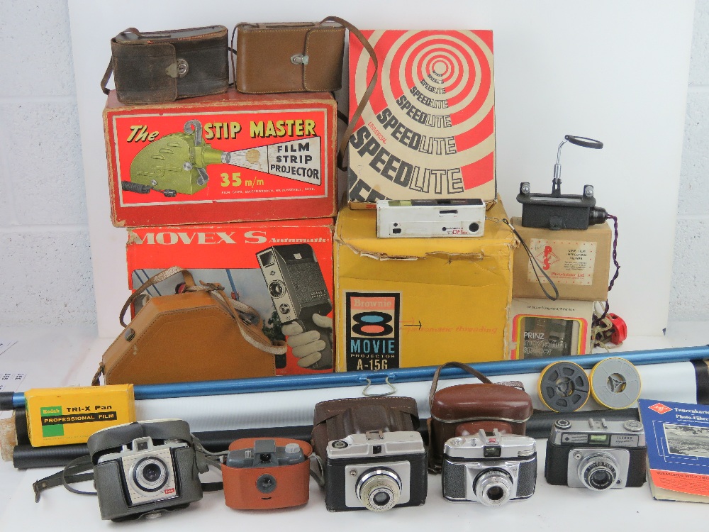 A quantity of assorted 1960s and 1970s camera and cine equipment including; Kodak Brownie 8 movie