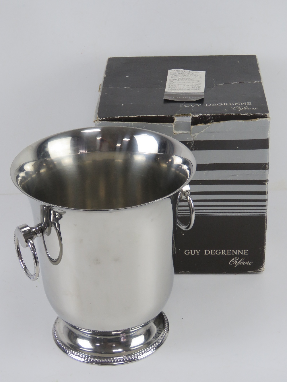 A Guy Degrenne champagne ice bucket, as new in box.