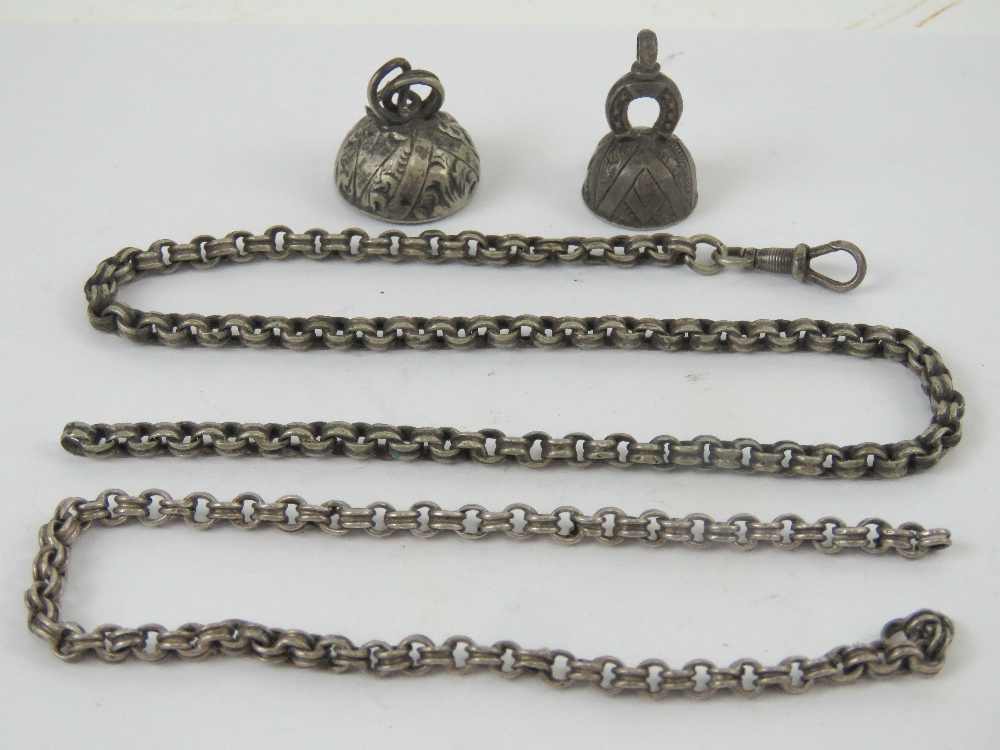 A vintage white metal watch chain with clasp, together with two white metal seal fobs. A/F.