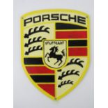 A contemporary cast metal 'Porsche' wall sign measuring 30 x 22.5cm.