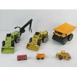 Three Tonka toys being dumper truck, loader and trencher. Together with some other model toy