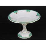 A good Davenport Longport cream ground and gilded footed tazza decorated with vine leaves upon, 29cm