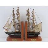 A pair of contemporary bookends in the form of the Cutty Sark complete with fabric sails, approx