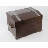 An Art Deco stained oak tea caddy, lid lifting to reveal pull-out compartment within,