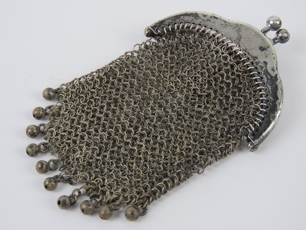 A white metal chain link purse having chain loop handle, no apparent hallmarks, approx 7.5 x 4.5cm.