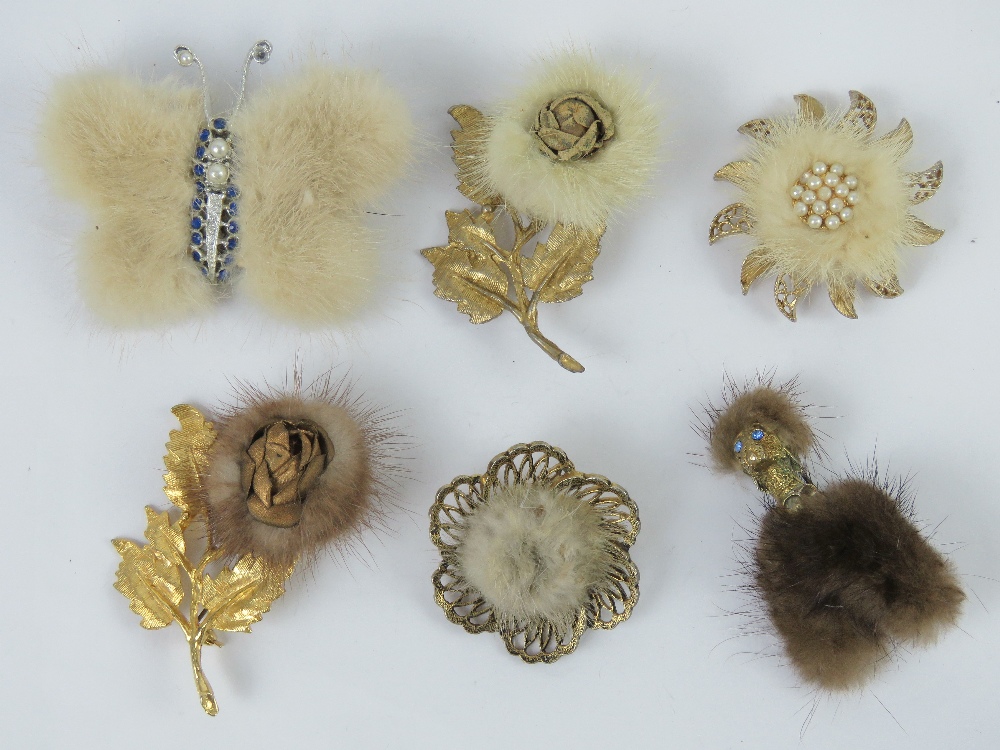 Six early 20th century fur brooches in the form of a dog, a butterfly and flowers.