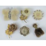Six early 20th century fur brooches in the form of a dog, a butterfly and flowers.