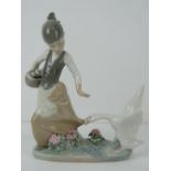 Lladro figurine 1288 'Aggressive Goose' a girl carrying basket of eggs with goose pecking at