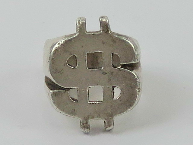 A heavy HM silver Dollar symbol ($) ring, size P, hallmarked for Sheffield, 22.4g