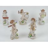 A set of five ceramic angelic musicians, Continental, each approx 12cm high, each with 'N' with