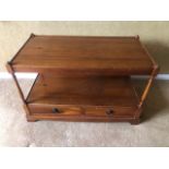 A contemporary mahogany coffee table having twin drawers to the base, 83 x 43 x 53cm.