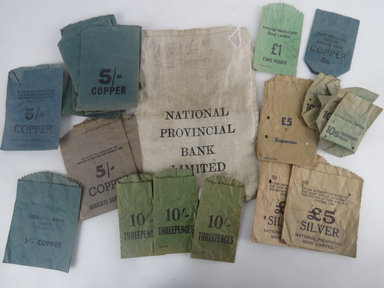 A National Provincial Bank Ltd cloth cash bag containing a quantity of pre-decimalisation coin