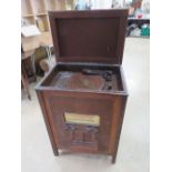 An early New Universal radiogram having turntable with Bakelite stylus to the top, forward facing