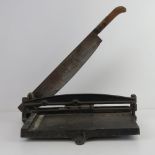 A vintage hinged paper guillotine on cast metal base, c1950s.