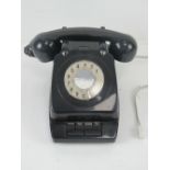 A vintage office extension/transfer rotary telephone in black.