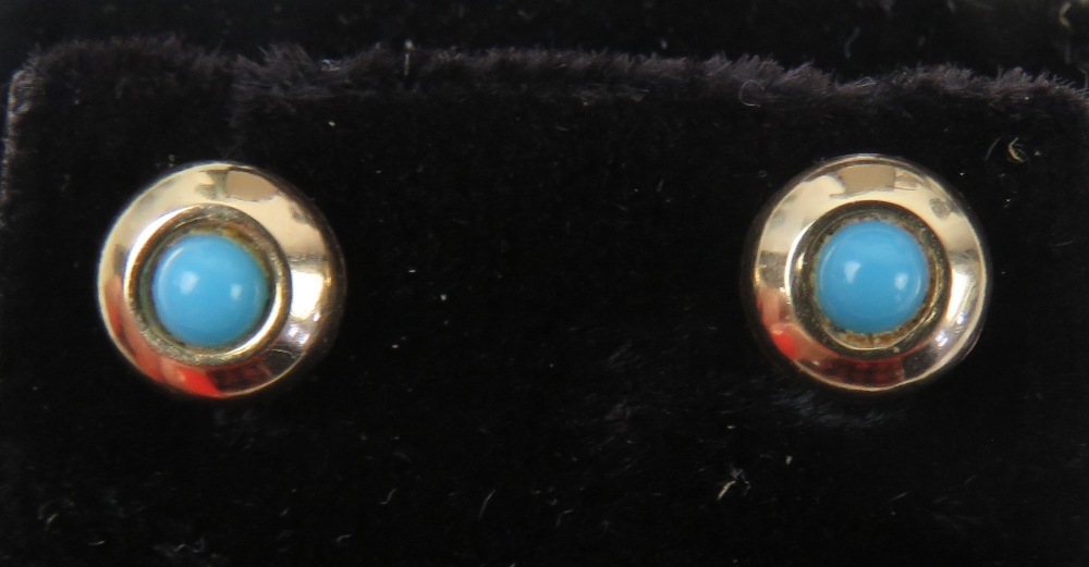 A pair of turquoise stud earrings, no apparent hallmarks, with butterfly backs.